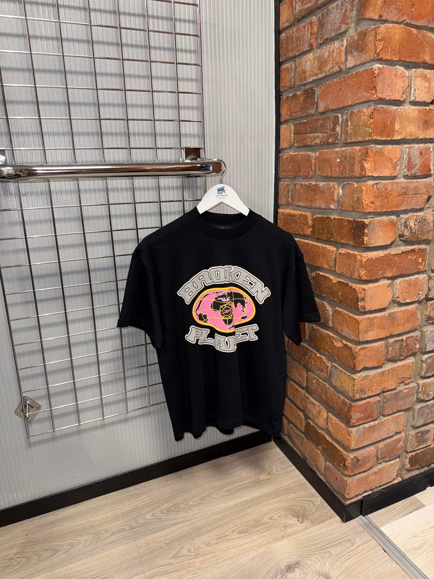 Broken Planet Pink Globe | Midnight Black Tee
